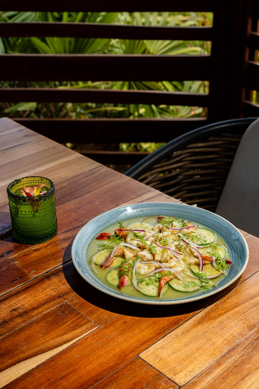 Green shrimp aguachile on the wooden table