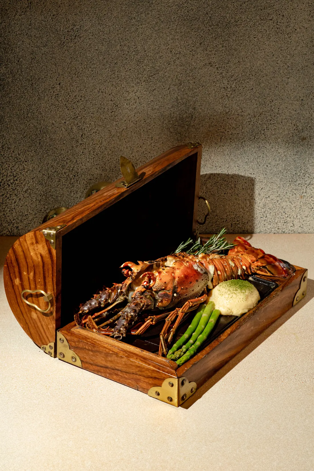 Lobster thermidor served in its wooden chest