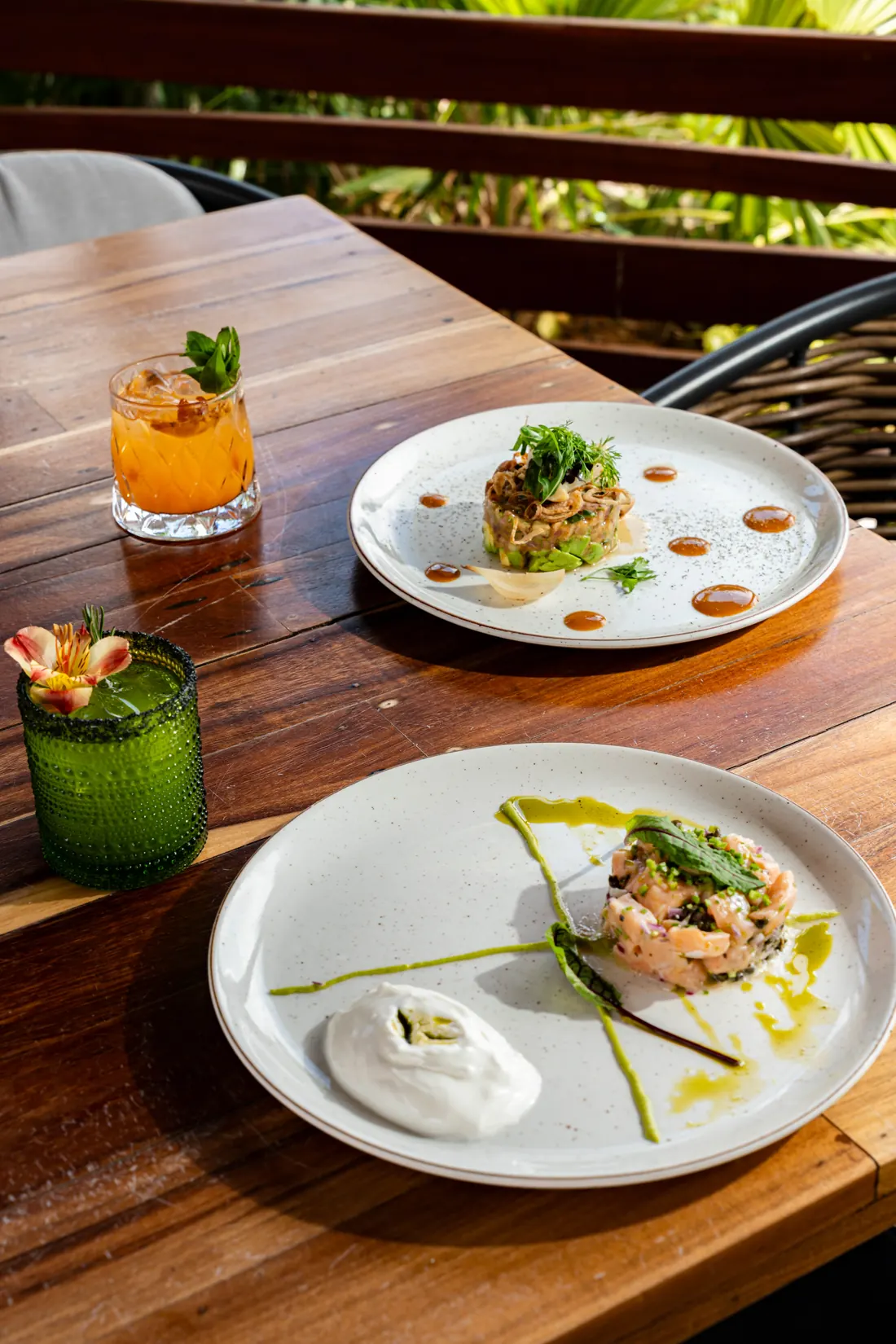 Two dishes and a glass on the table, ready to share