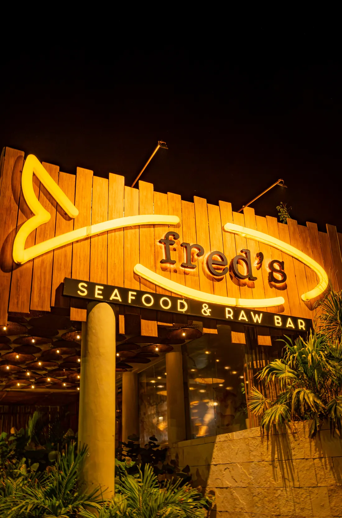 Fred’s neon sign lit up at night