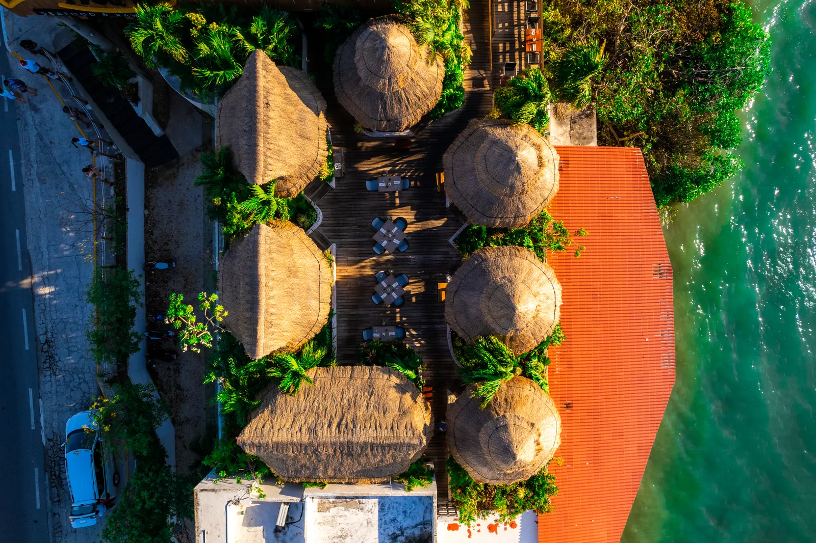 The Villas seen from directly above, beside the turquoise water