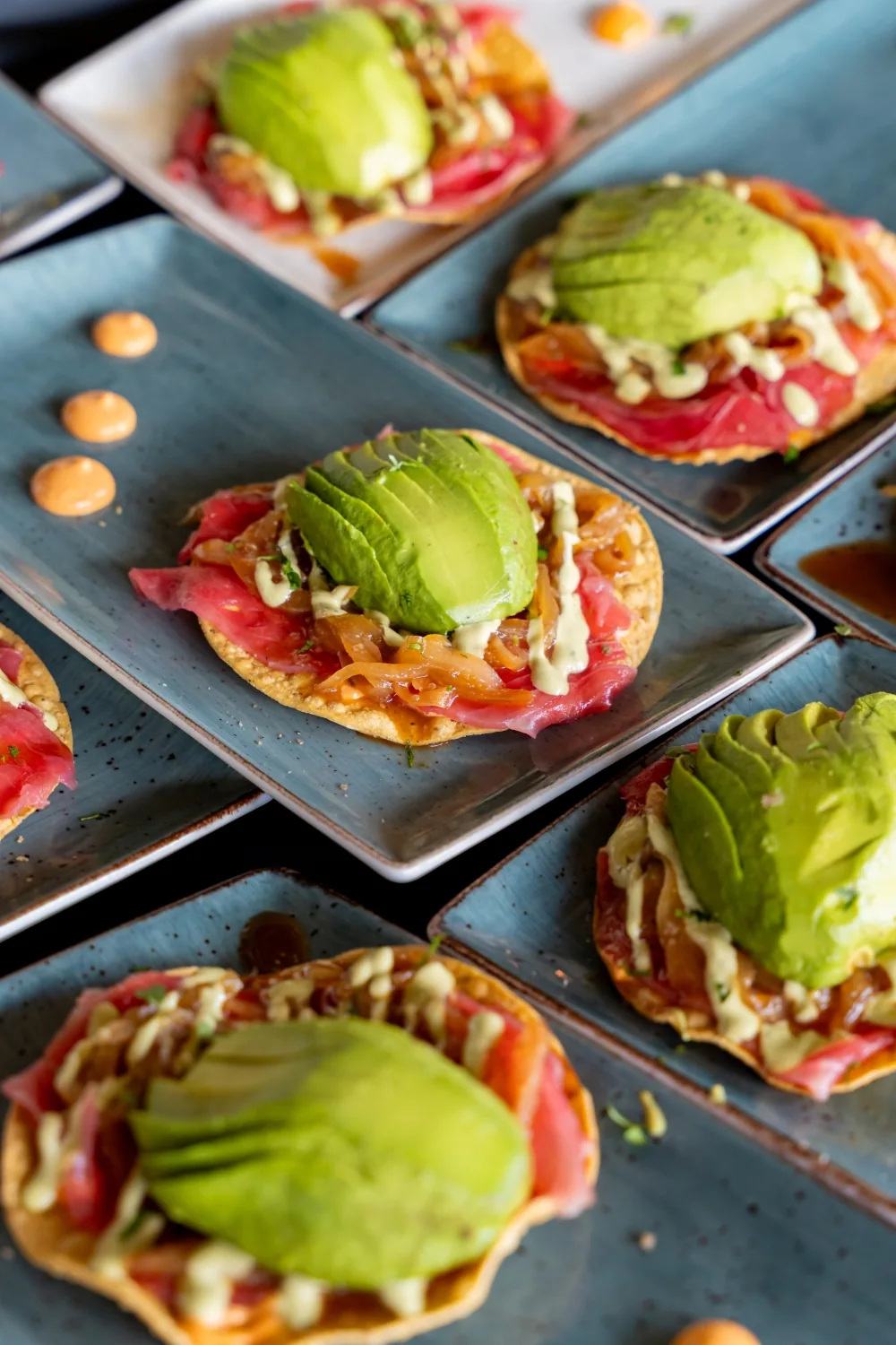 Tuna tostadas with avocado and caramelised onion, ready to go out